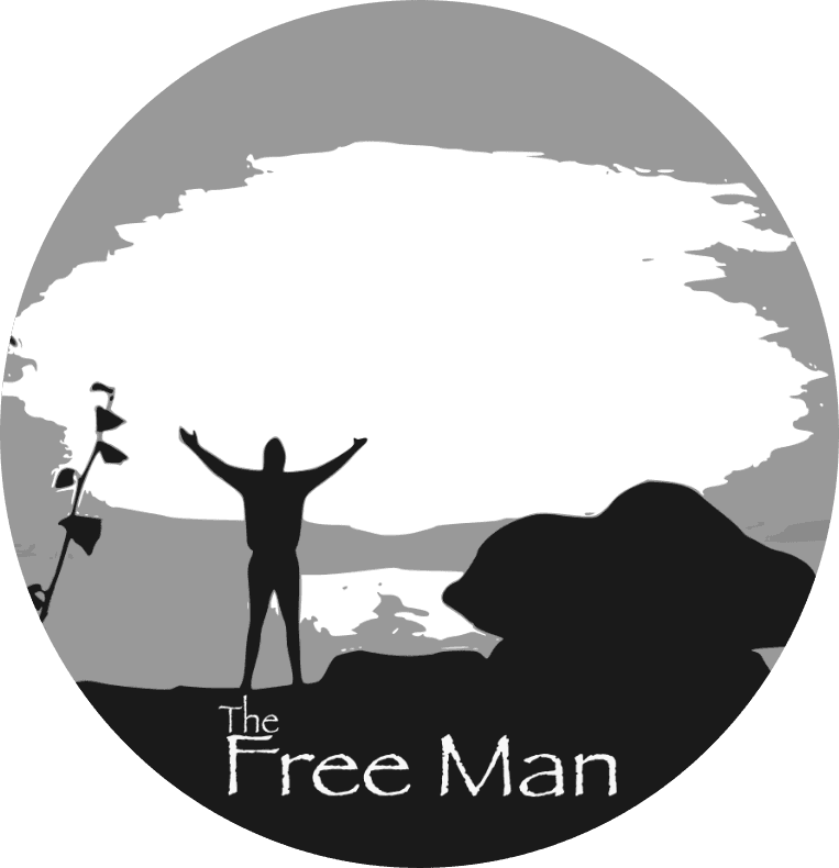 Circular logo showing silhouette of person with raised arms on rocky landscape with large tree, text "The Free Man" below